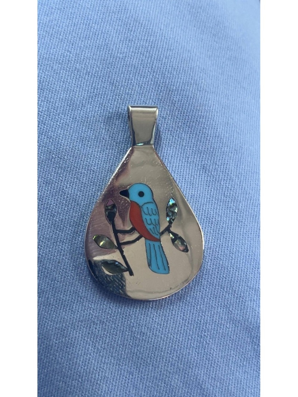 Zuni coral, mother of pearl western blue bird inlay sterling silver pendant